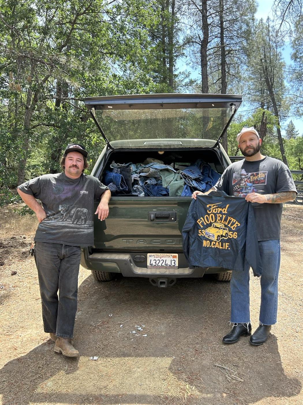 Sam and Jake of California Vintage Buyers behind a truck bed loaded with vintage denim from a buying trip