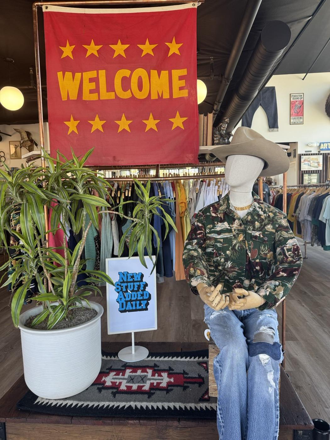The welcome banner and a mannequin in vintage western wear at Old 44 Vintage