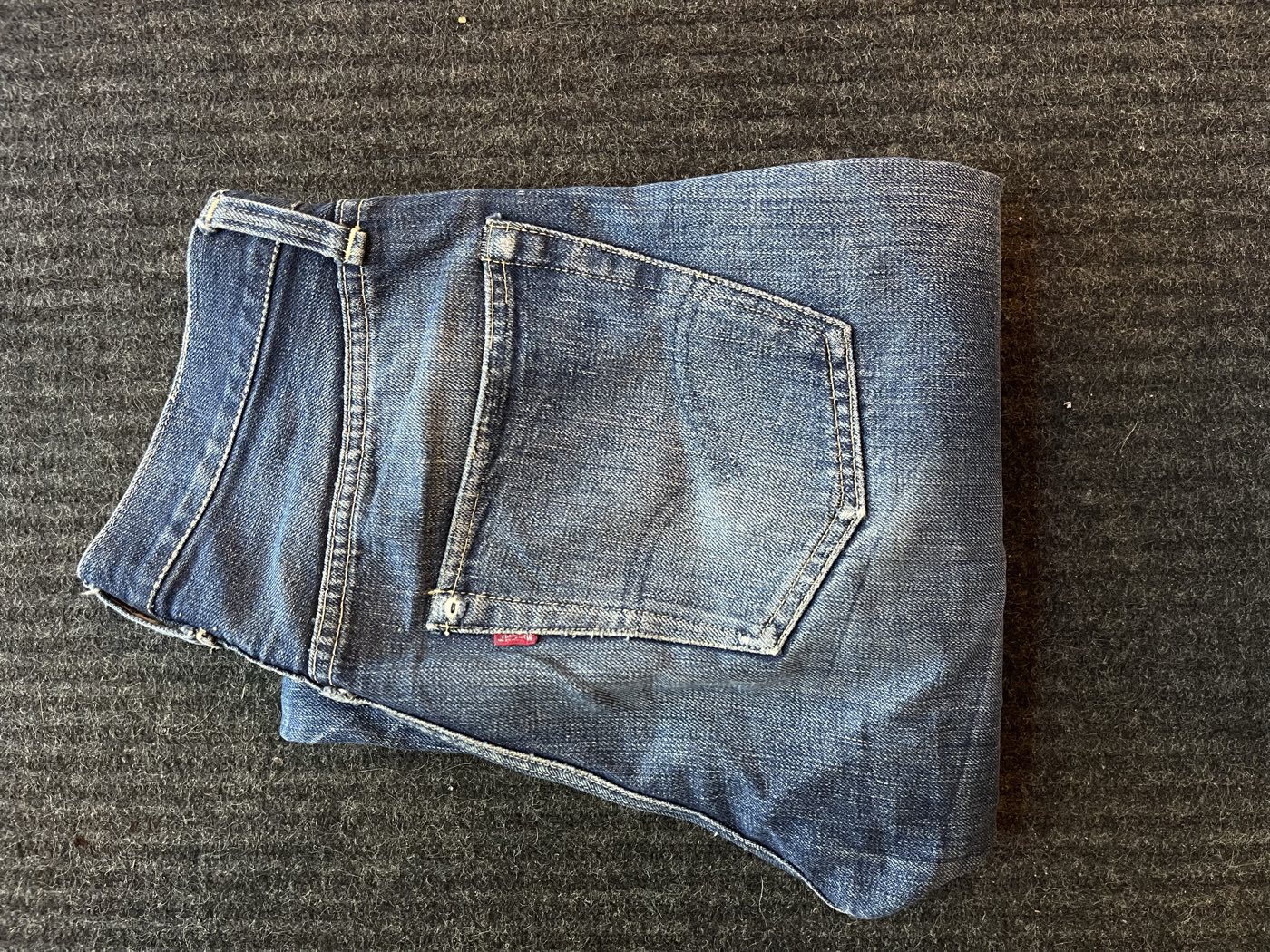 1940s Levi's 501XX jeans folded to show the back pockets and one-sided red tab, bought by California Vintage Buyers