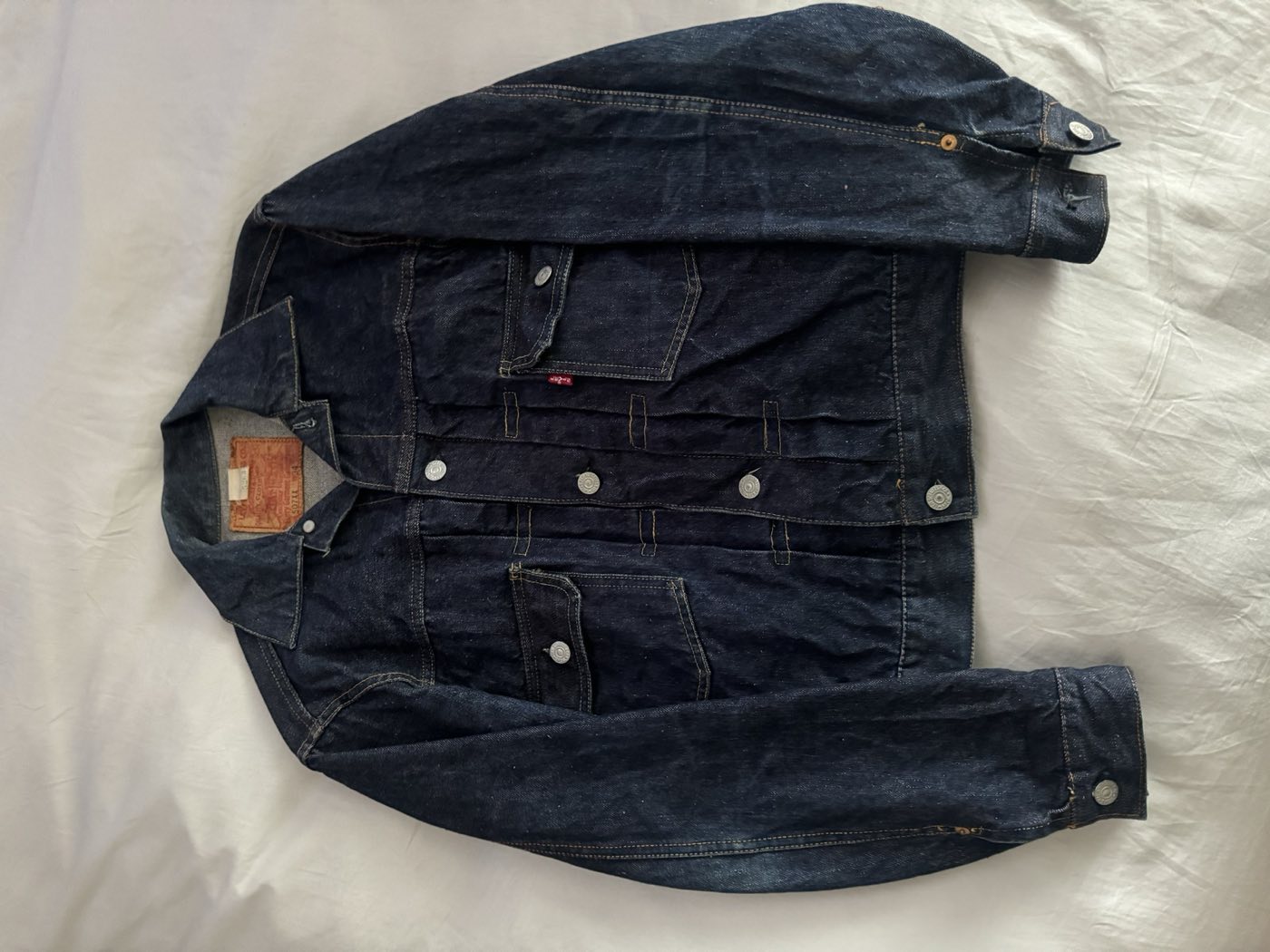 Dark indigo 1950s Levi's 507XX Type 2 denim jacket, two pleated chest pockets, paper patch intact